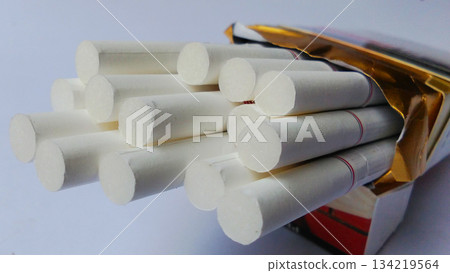Close-up image of cigarettes in an open pack. 134219564