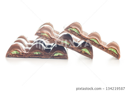 Chocolate bar with pistachios cream isolated on white background. 134219587