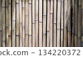 Bamboo fence wall panels with vertical polish create a rustic style wall. 134220372