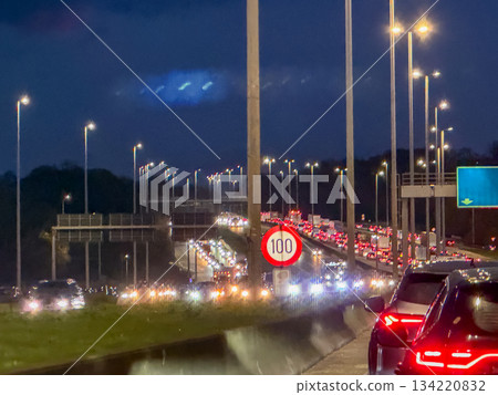 Urban night journey with reflective wet roads and distant lights Urban night journey with reflective wet roads and distant lights 134220832