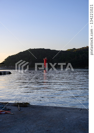 Red lighthouse and water scenery in the harbor Red lighthouse and water scenery in the harbor 134221021