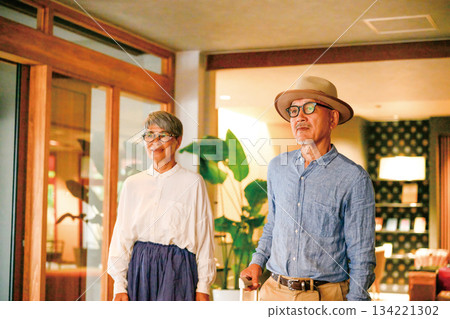 Relaxed mature couple traveling Relaxed mature couple traveling 134221302