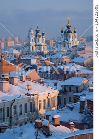 orthodox new year city silhouette snowy rooftops blue gold palette 134222608