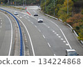 Vehicles merging from a highway parking lot 134224868