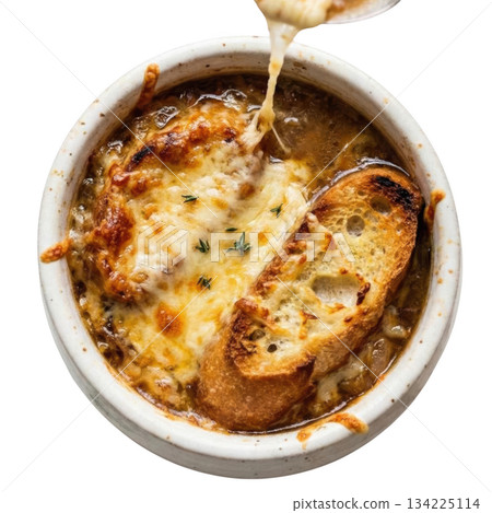 Comforting bowl of French onion soup, warm gratinee food with delicious golden melted cheese crust on top 134225114