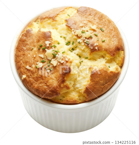 Warm, delicious savory cheese souffle, perfectly risen French food baked in white ramekin with fresh herbs 134225116