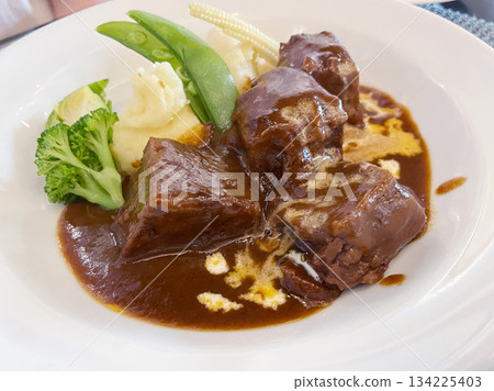 Braised Japanese Black Wagyu Beef in Demi-Glace Sauce: A luxurious dish featuring high-quality beef. Braised Japanese Black Wagyu Beef in Demi-Glace Sauce: A luxurious dish featuring high-quality beef. 134225403