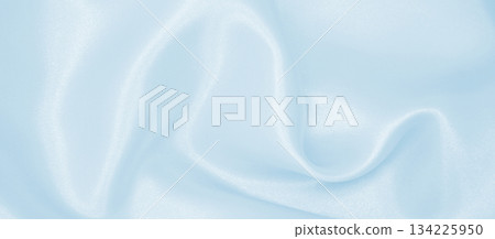 Smooth elegant blue silk or satin luxury cloth texture as abstract background. Luxurious background design Smooth elegant blue silk or satin luxury cloth texture as abstract background. Luxurious background design 134225950