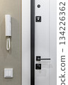 Modern Apartment Entrance Door with Intercom and Light Switch 134226362