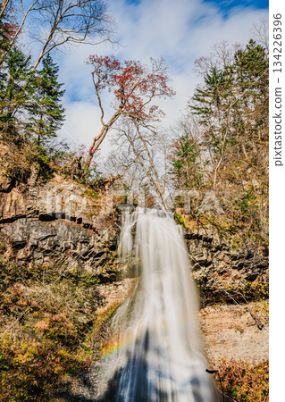 Kamimon Falls, nestled in the late autumn forest, is a hidden waterfall in Omu Town Kamimon Falls, nestled in the late autumn forest, is a hidden waterfall in Omu Town 134226396