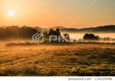 A fantastic mountain scenery created by the soft morning sun and mist A fantastic mountain scenery created by the soft morning sun and mist 134226406