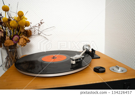 Vinyl disk on player in playing position Vinyl disk on player in playing position 134226457