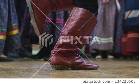 Russian folk dance - foot in boots of boy dancing Russian folk dance - foot in boots of boy dancing 134226505