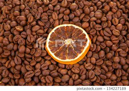 dehydrated orange slices and roasted coffee beans, merging citrus  134227189