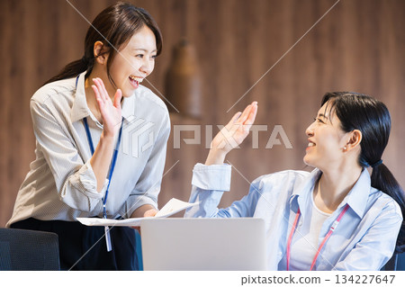 Business woman giving a high five 134227647