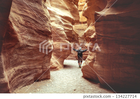 Young man walking in Red Canyon in the Negev Desert near Eilat, Israel 134227714