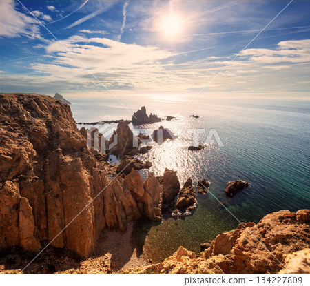 Coastal rocky seascape, view of Praia da Marinha beach in the Algarve region in the Atlantic Ocean on a sunny day, Portugal, Europe 134227809