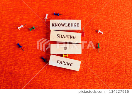 Wooden blocks arranged to convey a meaningful message showcase the importance of sharing knowledge Wooden blocks arranged to convey a meaningful message showcase the importance of sharing knowledge 134227916