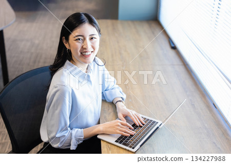 Woman using a laptop Woman using a laptop 134227988