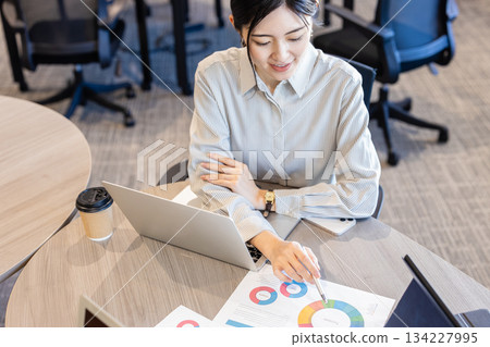 Young woman working in the office Young woman working in the office 134227995