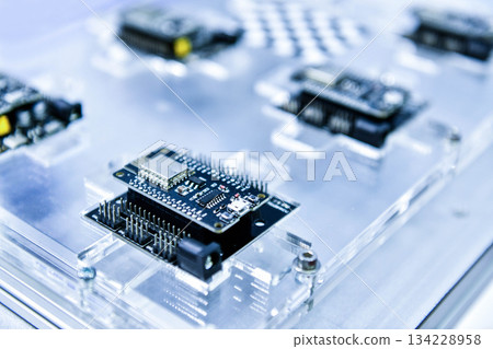 Macro Shot of Computer Processor Production Line print circuit board (PCB) in Bright Environment in Factory. 134228958