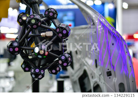 3D scanner on robotic arm measure the accuracy of large automotive parts. in industrial plants 3D scanner on robotic arm measure the accuracy of large automotive parts. in industrial plants 134229115