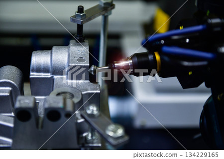 Spindle cutting tool Rotary 5-axis CNC milling machine during deburring of engine parts, heavy industry plan 134229165
