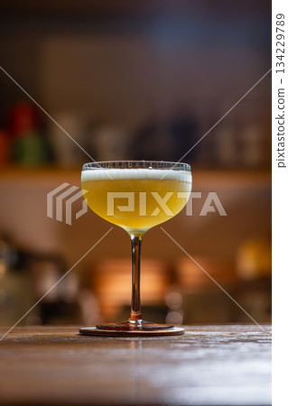 Elegant cocktail with citrus foam Elegant cocktail with citrus foam 134229789