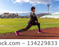 Woman stretching in lunge 134229833