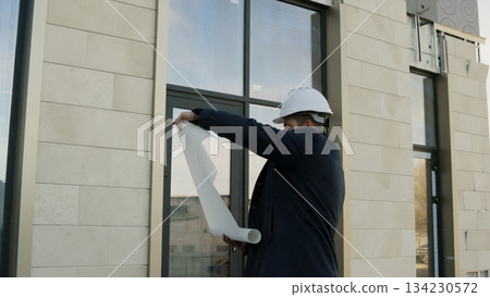 Supervisor on construction site pointing and discussing project details Supervisor on construction site pointing and discussing project details 134230572