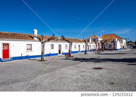 Porto Covo, Portugal - Feb 28, 2025: Traditional blue and white Alentejo Portuguese buildings in Porto Covo, Portugal Porto Covo, Portugal - Feb 28, 2025: Traditional blue and white Alentejo Portuguese buildings in Porto Covo, Portugal 134231012