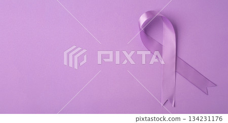 Lilac ribbon on purple background. Lilac ribbon on purple background. 134231176