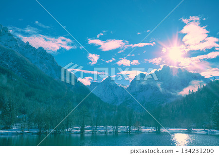 Lake Jasna in a mountain valley in winter. The tops of the mountains are covered with snow. View of the Alps in Kranjska Gora at dawn. Triglav National Park. Slovenia, Europe Lake Jasna in a mountain valley in winter. The tops of the mountains are covered with snow. View of the Alps in Kranjska Gora at dawn. Triglav National Park. Slovenia, Europe 134231200