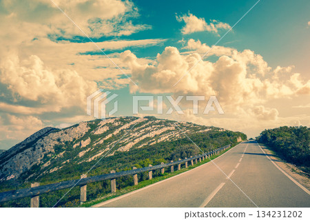 Driving a car on a mountain winding road in National park Picos de Europa. Spain, Europe Driving a car on a mountain winding road in National park Picos de Europa. Spain, Europe 134231202