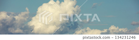 Blue sky with clouds. Cloudy sky background. Horizontal banner 134231246