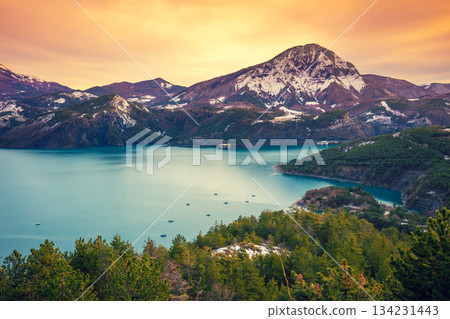 Mountain lake in autumn Aerial view. Serre-Poncon mountain lake during sunset in winter in Hautes Alpes, France Mountain lake in autumn Aerial view. Serre-Poncon mountain lake during sunset in winter in Hautes Alpes, France 134231443