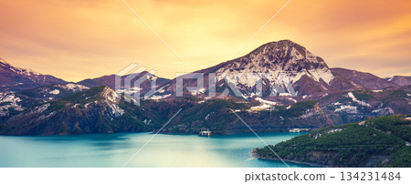 Mountain lake in autumn Aerial view. Serre-Poncon mountain lake during sunset in winter in Hautes Alpes, France 134231484