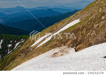 Mount Tanigawa with snow remaining and the mountain ranges of Mount Azumaya, Mount Komochi, and Mount Haruna seen from the climb up Nishikuro Ridge Mount Tanigawa with snow remaining and the mountain ranges of Mount Azumaya, Mount Komochi, and Mount Haruna seen from the climb up Nishikuro Ridge 134232179