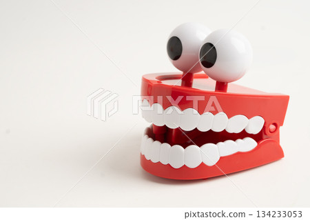 Funny red teeth with eye toy denture model for dental health care. 134233053