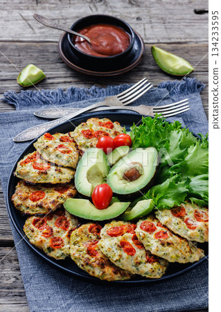minced chicken cherry tomatoes patties on a plate minced chicken cherry tomatoes patties on a plate 134233595