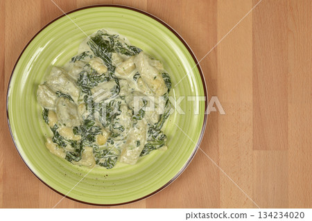 Gnocchi with creamy spinach sauce Gnocchi with creamy spinach sauce 134234020