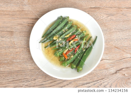 boiled roselle dressing sesame oil and soy sauce with chop garlic topping slice chili on plate 134234156