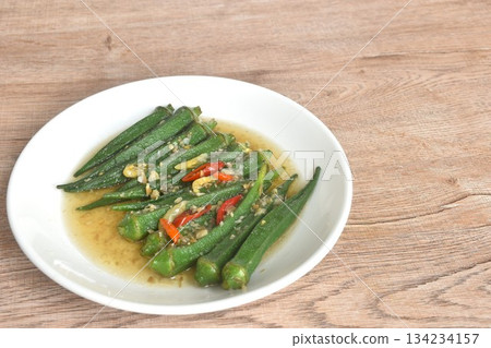 boiled roselle dressing sesame oil and soy sauce with chop garlic topping slice chili on plate 134234157