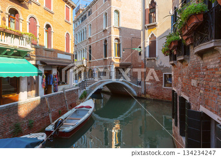 Canal with traditional buildings in Venice Italy Canal with traditional buildings in Venice Italy 134234247