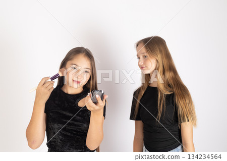 Two teenage girls talking and expressing emotions on a white background 134234564