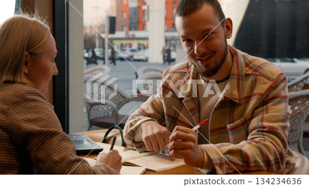 Young man talking and gesturing, actively engaged in a discussion Young man talking and gesturing, actively engaged in a discussion 134234636