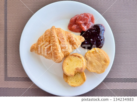 European breakfast croissants with strawberry and blackberry jam and aromatic coffee European breakfast croissants with strawberry and blackberry jam and aromatic coffee 134234983