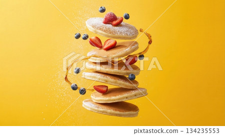 Flying Stack Of Pancakes With Berries And Honey Syrup Art Flying Stack Of Pancakes With Berries And Honey Syrup Art 134235553