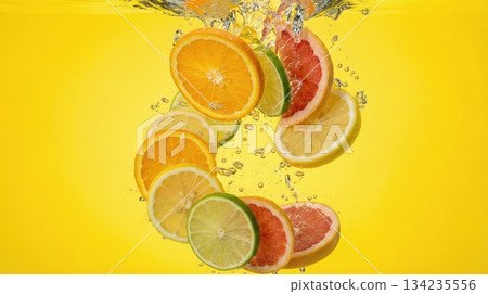 Exploded View Of Tropical Citrus Fruit Slices And Juice Splash Exploded View Of Tropical Citrus Fruit Slices And Juice Splash 134235556