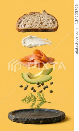 Deconstructed Salmon And Avocado Toast Ingredients yellow background 134235796